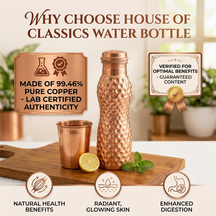 Copper water bottle and cup on a wooden board 